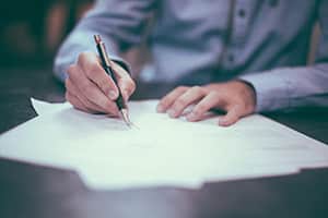Lawyer signing a commercial contract